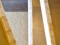Looking down at the floor from several stories up as several pedestrian bridges cross the frame at different angles.