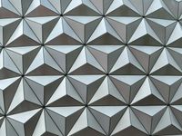 Abstract close-up of the metallic triangular pattern that makes up the surface of Spaceshop Earth's sphere.