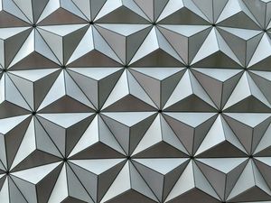 Abstract close-up of the metallic triangular pattern that makes up the surface of Spaceshop Earth's sphere.